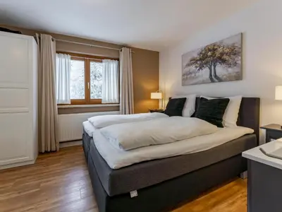 Ein Bett oder Betten in einem Zimmer der Unterkunft Neva S Saalbach