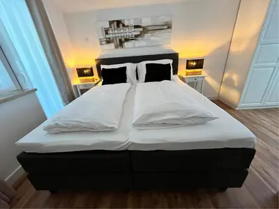 Ein Bett oder Betten in einem Zimmer der Unterkunft Neva S Saalbach