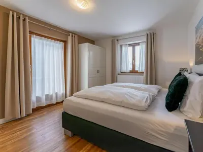 Ein Bett oder Betten in einem Zimmer der Unterkunft Neva S Saalbach