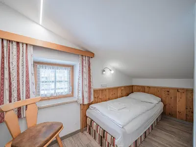 Ein Bett oder Betten in einem Zimmer der Unterkunft Röck III IV