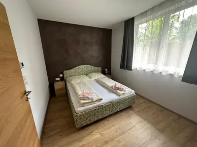 Ein Bett oder Betten in einem Zimmer der Unterkunft Top 1 Gartenwohnung