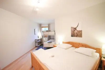 Ein Bett oder Betten in einem Zimmer der Unterkunft Ferienwohnung 77 - Top 23