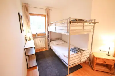 Ein Bett oder Betten in einem Zimmer der Unterkunft Ferienwohnung 77 - Top 23
