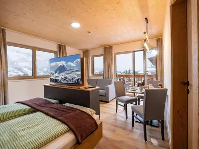 Ein Bett oder Betten in einem Zimmer der Unterkunft M&M Appartements Brixental