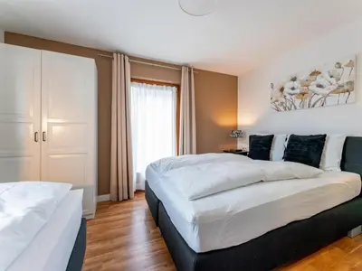 Ein Bett oder Betten in einem Zimmer der Unterkunft Neva Saalbach