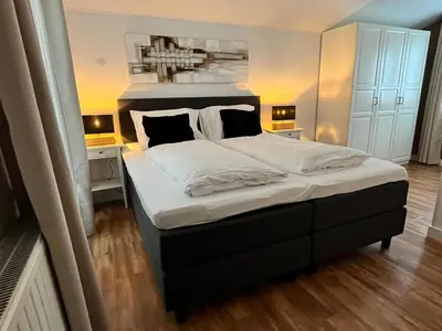 Ein Bett oder Betten in einem Zimmer der Unterkunft Neva Saalbach