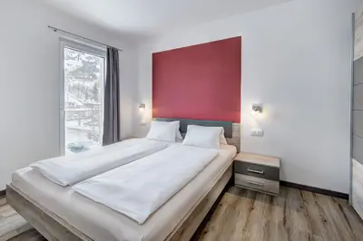 Ein Bett oder Betten in einem Zimmer der Unterkunft LoriVita Residenz Saalbach