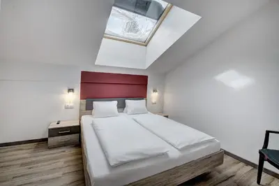 Ein Bett oder Betten in einem Zimmer der Unterkunft LoriVita Residenz Saalbach