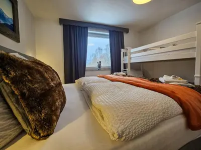 Ein Bett oder Betten in einem Zimmer der Unterkunft Gruppenhaus Alpenglück
