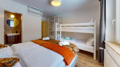 Ein Bett oder Betten in einem Zimmer der Unterkunft Gruppenhaus Alpenglück