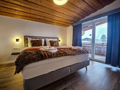 Ein Bett oder Betten in einem Zimmer der Unterkunft Gruppenhaus Alpenglück