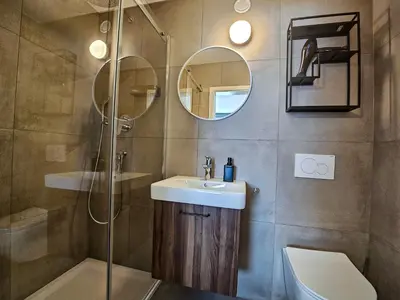 Ein Badezimmer in der Unterkunft Gruppenhaus Alpenglück