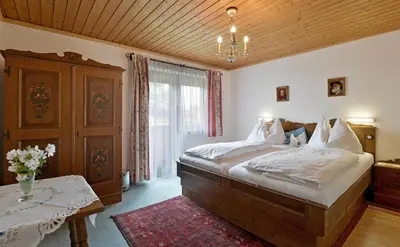 Ein Bett oder Betten in einem Zimmer der Unterkunft Ferienhaus Chalet Aumayr