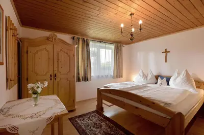 Ein Bett oder Betten in einem Zimmer der Unterkunft Ferienhaus Chalet Aumayr