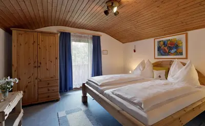 Ein Bett oder Betten in einem Zimmer der Unterkunft Ferienhaus Chalet Aumayr
