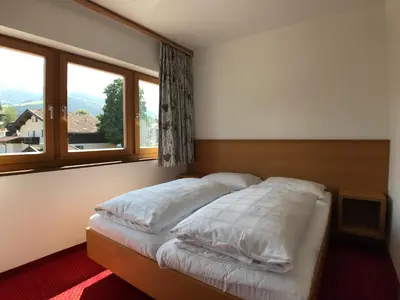 Ein Bett oder Betten in einem Zimmer der Unterkunft Appartements Robert - Hotel Bechlwirt