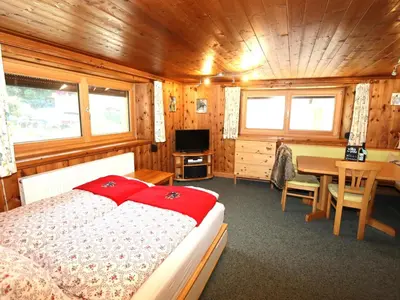 Ein Bett oder Betten in einem Zimmer der Unterkunft Tröger II