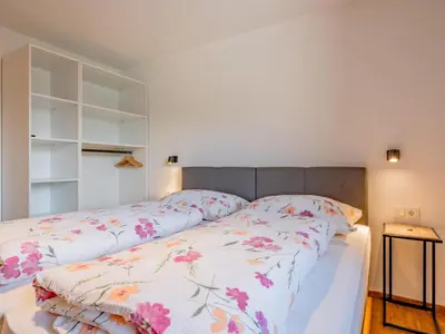 Ein Bett oder Betten in einem Zimmer der Unterkunft Hoferlitzlhubgut