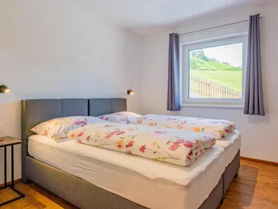 Ein Bett oder Betten in einem Zimmer der Unterkunft Hoferlitzlhubgut