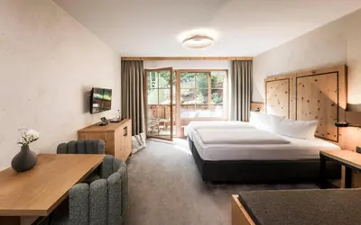 Ein Bett oder Betten in einem Zimmer der Unterkunft Das Kaltenbach - ApartHotel
