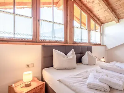 Ein Bett oder Betten in einem Zimmer der Unterkunft Appartementkombination Brixnerwirt III und IV