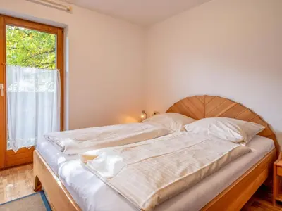 Ein Bett oder Betten in einem Zimmer der Unterkunft Appartementkombination Brixnerwirt I und II
