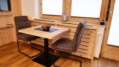 Ein Sitzbereich in der Unterkunft Bucherwirt Appartements