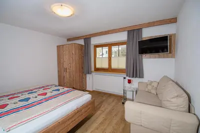 Ein Bett oder Betten in einem Zimmer der Unterkunft Landhaus Exenberger / Ferienwohnung Smaragd
