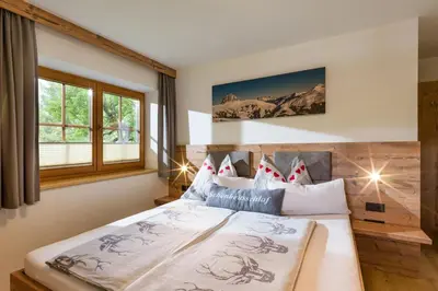 Ein Bett oder Betten in einem Zimmer der Unterkunft Landhaus Exenberger / Ferienwohnung Smaragd