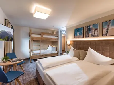 Ein Bett oder Betten in einem Zimmer der Unterkunft Alpen Glück Hotel Unterm Rain garni