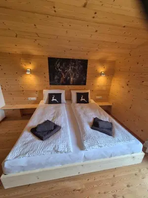 Ein Bett oder Betten in einem Zimmer der Unterkunft Chalet Romana