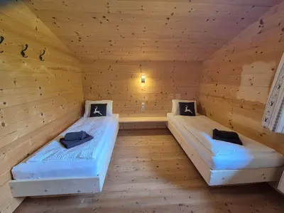 Ein Bett oder Betten in einem Zimmer der Unterkunft Chalet Romana