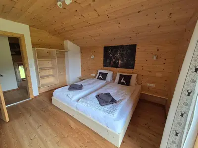Ein Bett oder Betten in einem Zimmer der Unterkunft Chalet Romana
