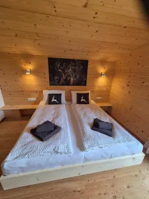 Ein Bett oder Betten in einem Zimmer der Unterkunft Chalet Romana