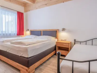 Ein Bett oder Betten in einem Zimmer der Unterkunft Blick auf den Rettenstein Top 1 und 2