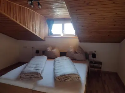 Ein Bett oder Betten in einem Zimmer der Unterkunft Jochelerhof
