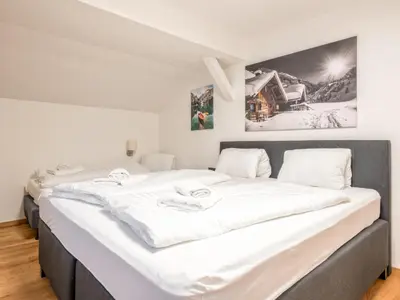 Ein Bett oder Betten in einem Zimmer der Unterkunft Chalet Hornblick
