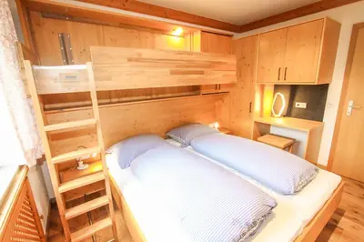 Ein Bett oder Betten in einem Zimmer der Unterkunft Ferienwohnung 77 - Top 36