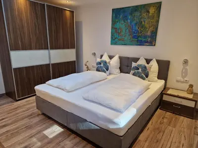 Ein Bett oder Betten in einem Zimmer der Unterkunft Ferienwohnung HELISA