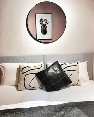 Ein Bett oder Betten in einem Zimmer der Unterkunft BOUTIQUE KAISERLODGE mit privater SAUNA & WHIRLPOOL by Belle Stay