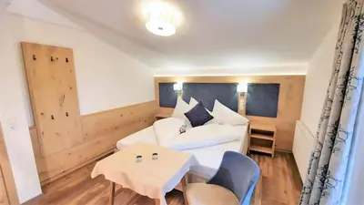 Ein Bett oder Betten in einem Zimmer der Unterkunft Heimat Apartments - Zillertal