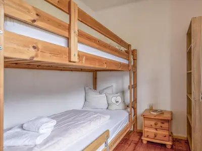 Ein Bett oder Betten in einem Zimmer der Unterkunft Platzhirsch