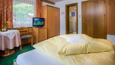 Ein Bett oder Betten in einem Zimmer der Unterkunft Landhaus Tipotsch