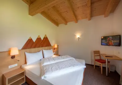 Ein Bett oder Betten in einem Zimmer der Unterkunft Alpen-Apart