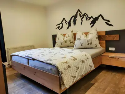 Ein Bett oder Betten in einem Zimmer der Unterkunft Ferienwohnung Bergzauber