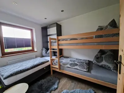 Ein Bett oder Betten in einem Zimmer der Unterkunft Ferienwohnung Bergzauber