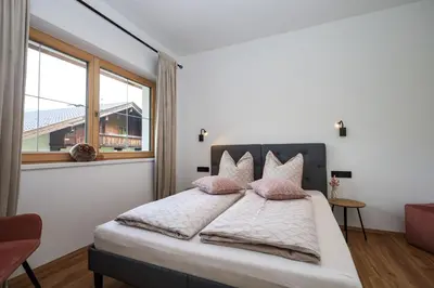 Ein Bett oder Betten in einem Zimmer der Unterkunft Apartment Alpbachtraum