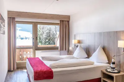 Ein Bett oder Betten in einem Zimmer der Unterkunft Ferienclub Bellevue am See