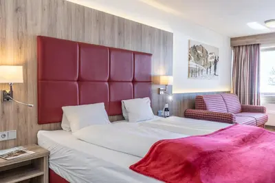 Ein Bett oder Betten in einem Zimmer der Unterkunft Ferienclub Bellevue am See