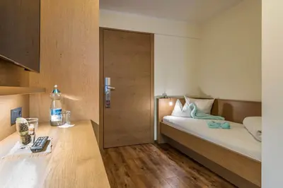 Ein Bett oder Betten in einem Zimmer der Unterkunft Aktivhotel Tuxerhof